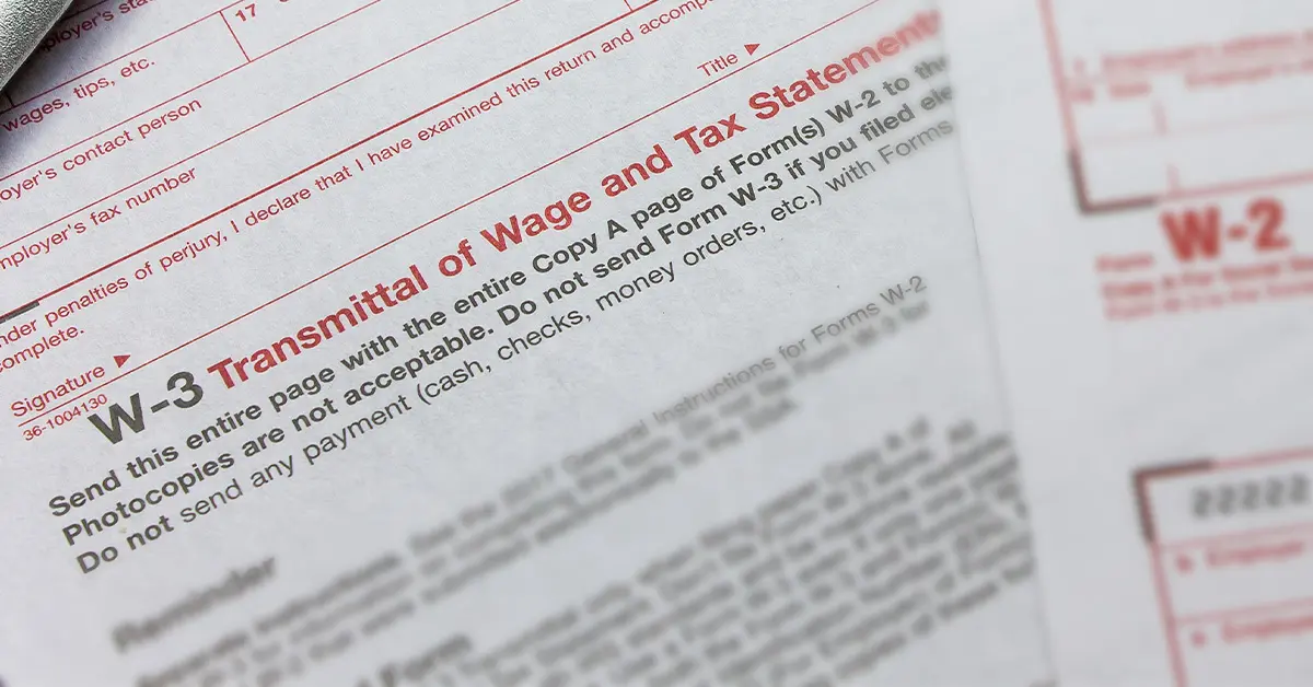 close-up photo of IRS form W3 (featured image: "What is a W3 Form and How to File It: Employer's Guide" blog)